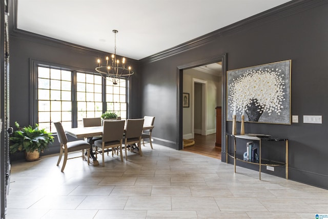 dining area featuring an inviting chandelier, ornamental molding, and baseboards