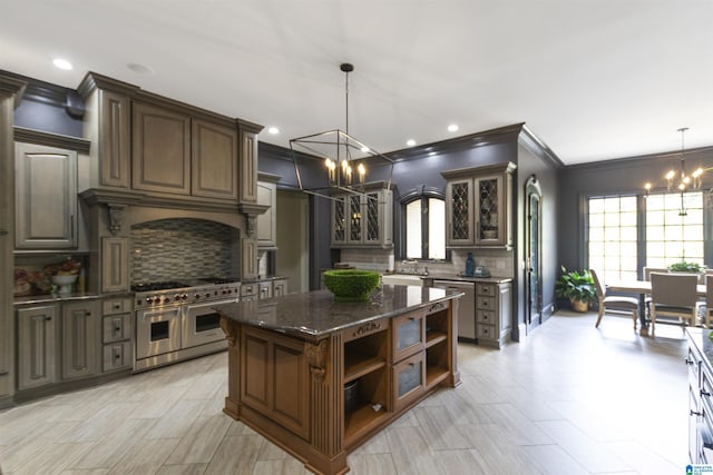 kitchen featuring open shelves, decorative backsplash, glass insert cabinets, double oven range, and a notable chandelier