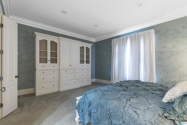 carpeted bedroom featuring ornamental molding and wallpapered walls