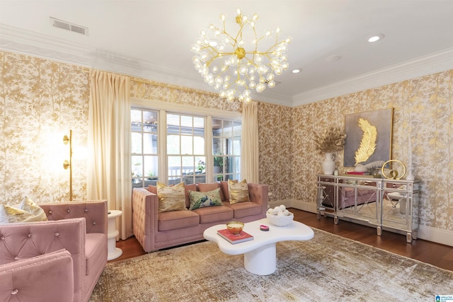 sitting room with crown molding, wood finished floors, wallpapered walls, a chandelier, and visible vents