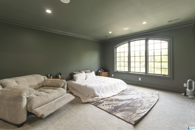 bedroom with carpet floors, ornamental molding, and recessed lighting