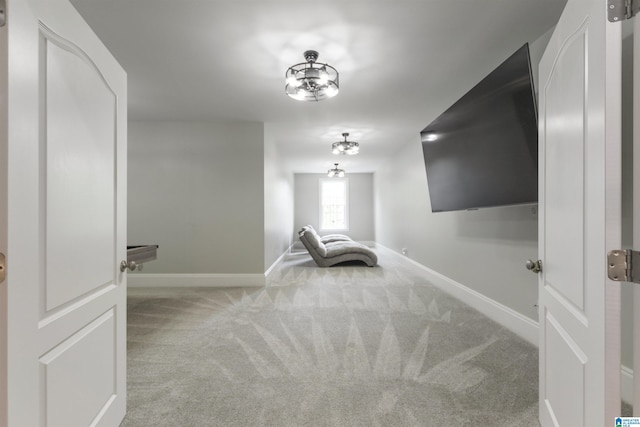 interior space featuring baseboards and carpet flooring