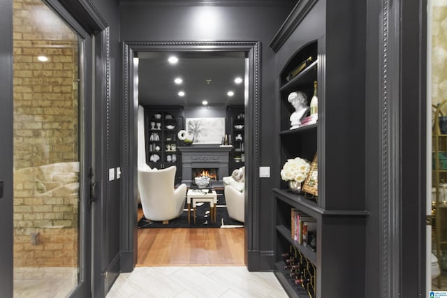 wine area with a warm lit fireplace and built in features