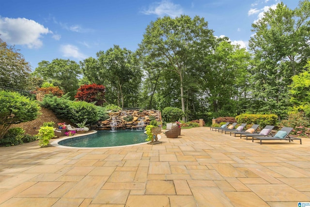 view of swimming pool featuring a patio area