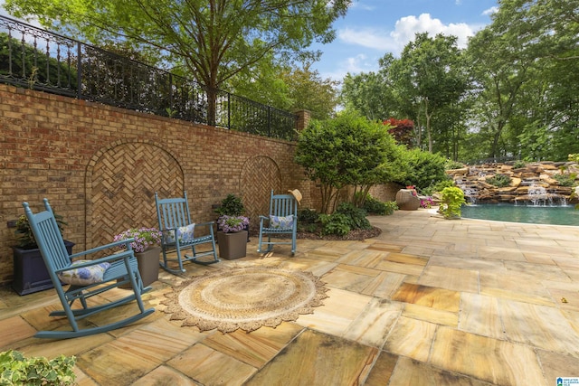 view of patio / terrace featuring fence