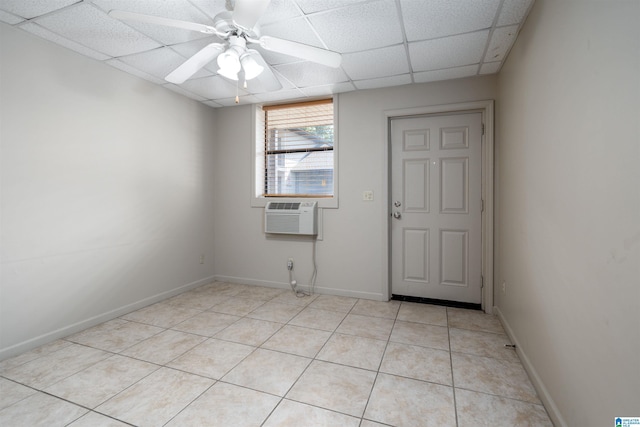 1212 12th St Unit 4, Tuscaloosa, AL 35401 - unfurnished room with a drop ceiling, light tile patterned floors, a ceiling fan, a wall mounted AC, and baseboards