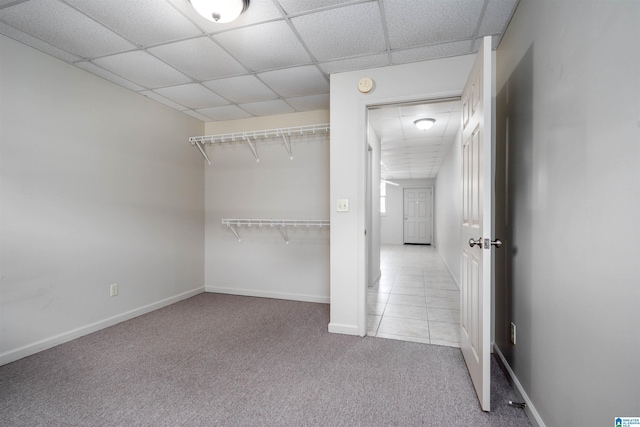 1212 12th St Unit 4, Tuscaloosa, AL 35401 - spacious closet with carpet floors, a paneled ceiling, and tile patterned flooring