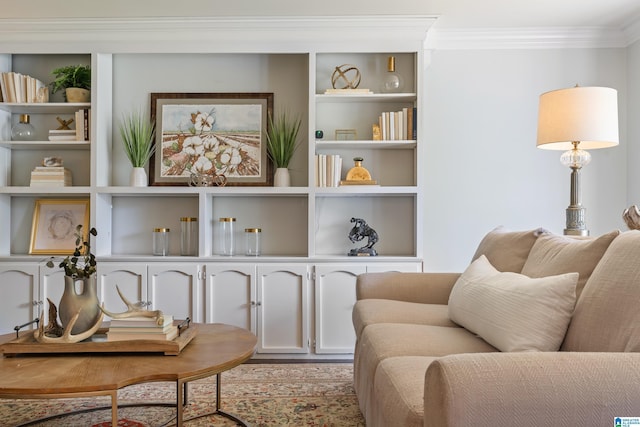 living area featuring ornamental molding and built in features