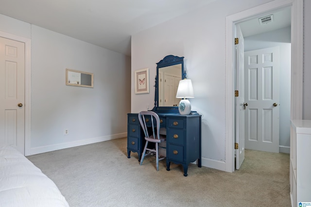 office area with baseboards, visible vents, and carpet