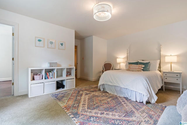bedroom featuring baseboards and carpet floors