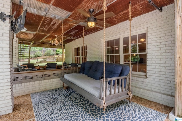 view of patio / terrace with an outdoor living space and a ceiling fan