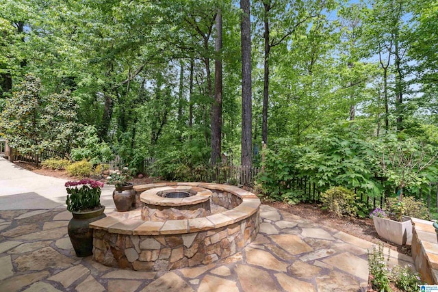 view of patio with a fire pit
