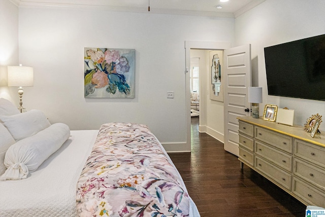 bedroom with crown molding, dark wood finished floors, and baseboards