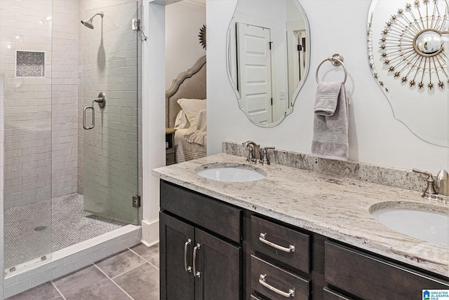 full bath featuring a stall shower and a sink