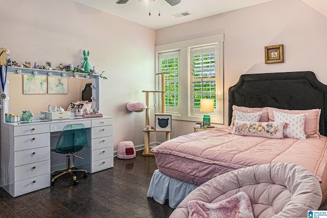 bedroom featuring visible vents, a ceiling fan, and dark wood-style flooring
