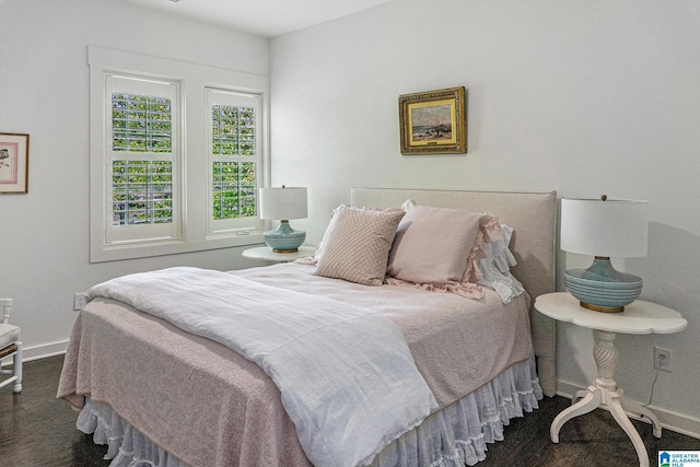 carpeted bedroom with baseboards