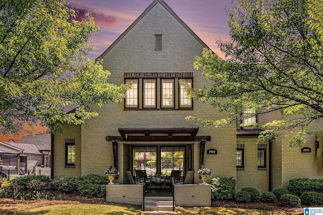 rear view of house with a porch