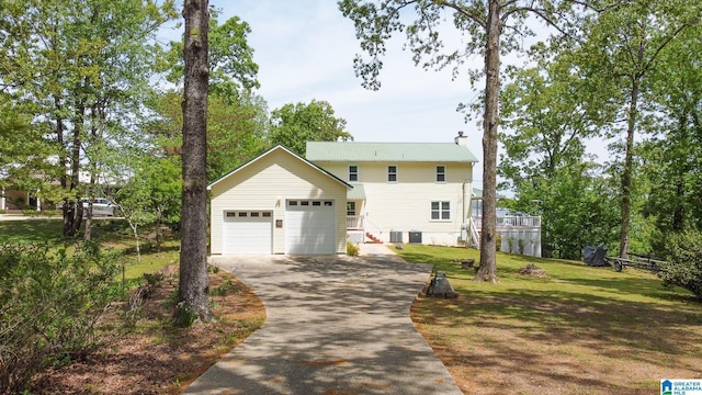 view of front facade featuring central AC unit, a front lawn, and a garage