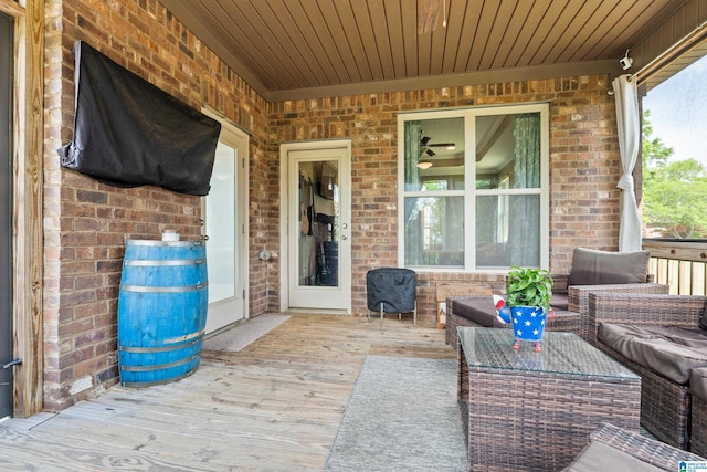wooden terrace featuring an outdoor hangout area