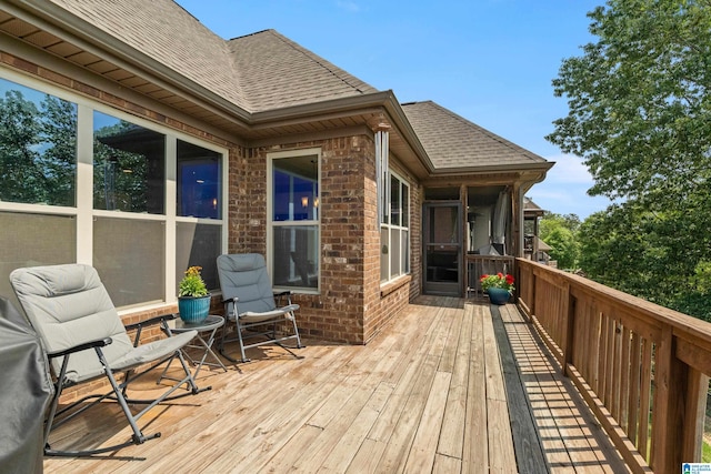 wooden terrace with a sunroom