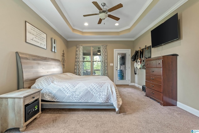 bedroom with a raised ceiling, a ceiling fan, light carpet, crown molding, and access to outside