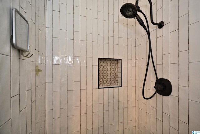 bathroom with a tile shower