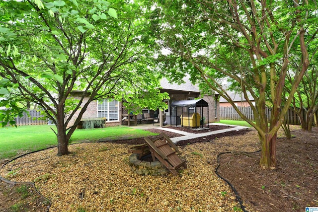 view of yard with fence, a patio, and a gazebo