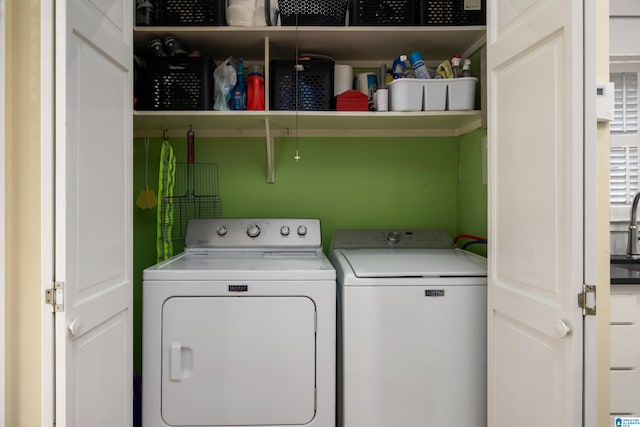 laundry area featuring washer and clothes dryer and laundry area