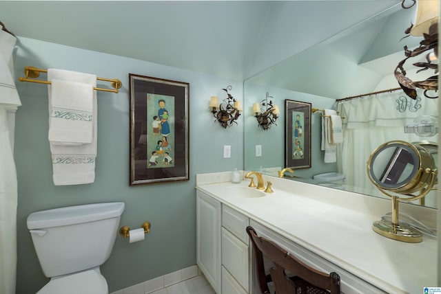 bathroom featuring tile patterned flooring, vaulted ceiling, toilet, vanity, and baseboards