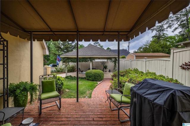 deck with a patio, fence, a gazebo, and grilling area
