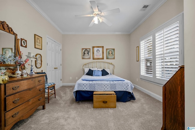 bedroom featuring visible vents, crown molding, carpet flooring, and baseboards
