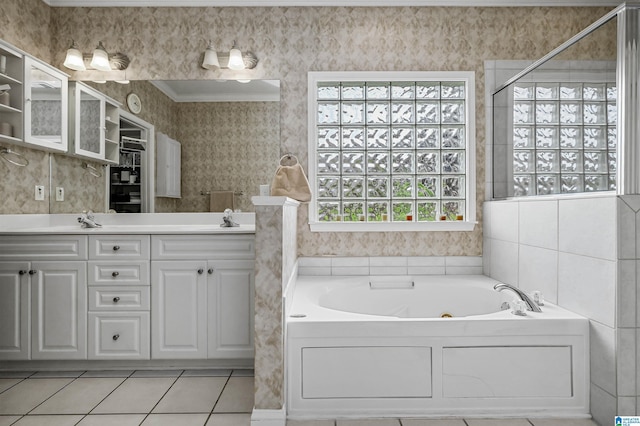 full bath featuring tile patterned flooring, wallpapered walls, double vanity, a bath, and a sink