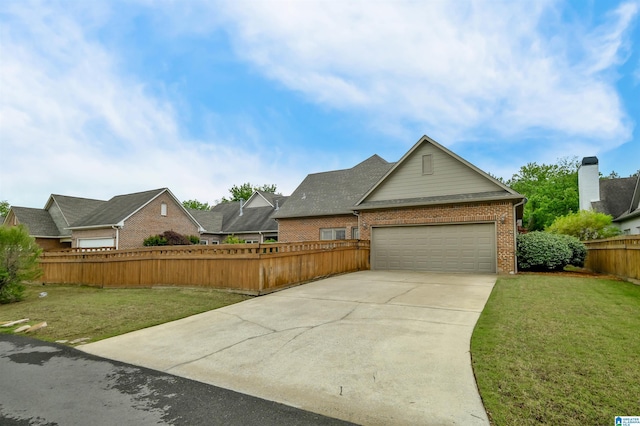 view of front facade featuring driveway, an attached garage, fence, brick siding, and a front lawn