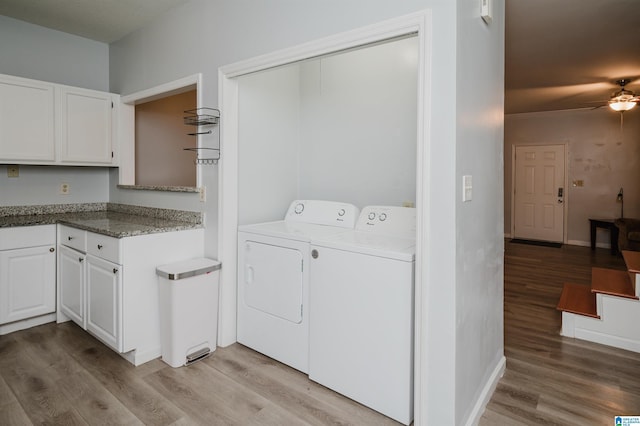 clothes washing area with light wood-type flooring, laundry area, independent washer and dryer, and ceiling fan