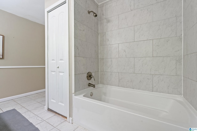 bathroom with shower / tub combination and baseboards