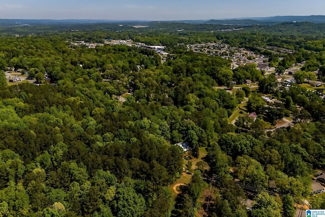 drone / aerial view featuring a view of trees