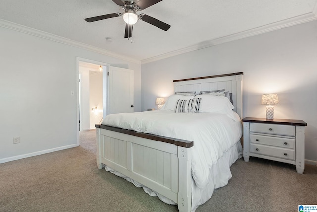 bedroom featuring baseboards, a ceiling fan, carpet floors, and crown molding