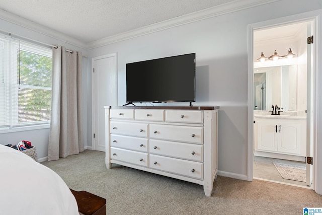 bedroom with ornamental molding, a sink, light colored carpet, and baseboards