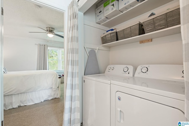 laundry room with carpet flooring, independent washer and dryer, laundry area, a ceiling fan, and ornamental molding