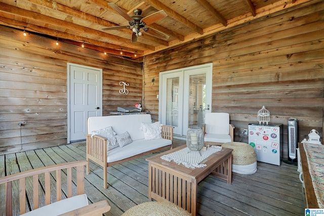 wooden deck with ceiling fan and an outdoor living space
