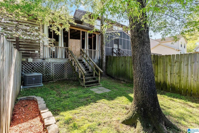view of yard with cooling unit and a fenced backyard