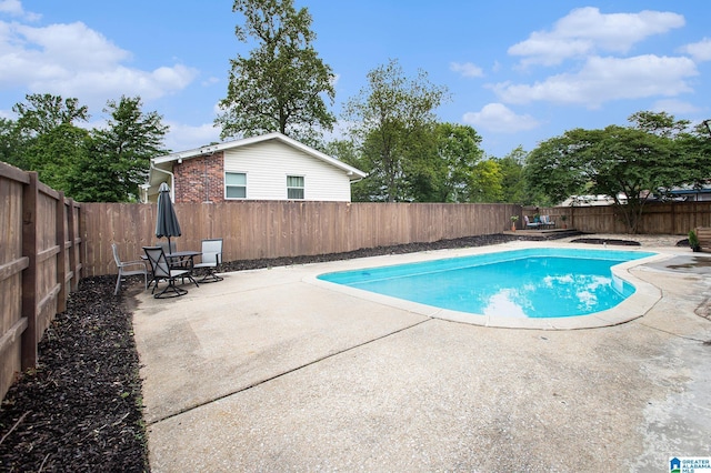 view of pool with a fenced in pool, a patio area, and a fenced backyard