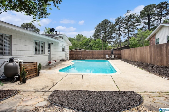 view of swimming pool with a patio, a fenced in pool, and a fenced backyard