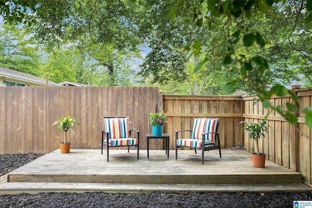 deck with a fenced backyard