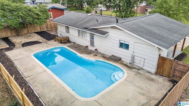 view of pool featuring a patio, a fenced in pool, and a fenced backyard