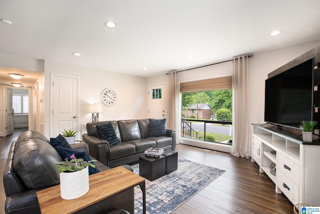 living area featuring dark wood-style floors and recessed lighting