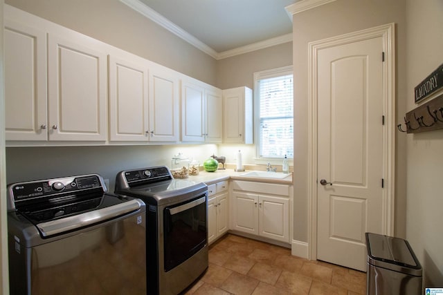 washroom featuring independent washer and dryer, cabinet space, crown molding, and light stone finish flooring