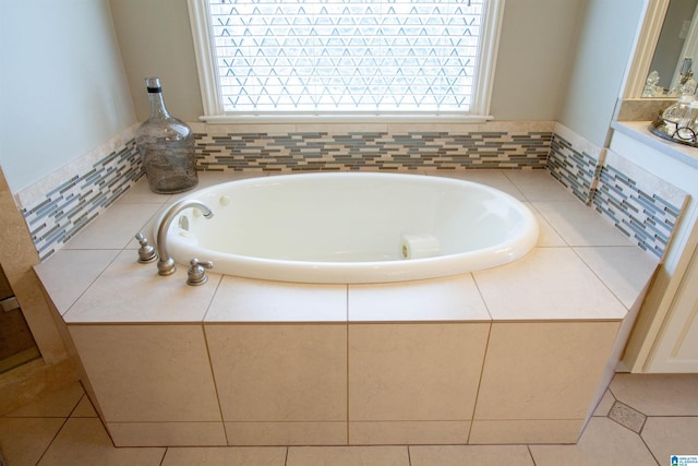 bathroom with plenty of natural light and a garden tub