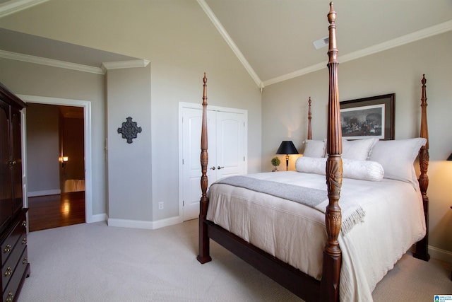 bedroom featuring light carpet, crown molding, baseboards, and vaulted ceiling