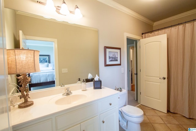 ensuite bathroom with crown molding, tile patterned flooring, vanity, and toilet